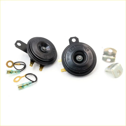 Black plastic 12v horn set for mazda rx series and 929 1967-1981 with gold mounting brackets and wiring connectors back view