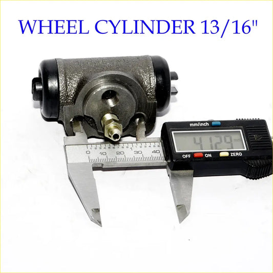 Black and metallic gray 13/16 rear brake cylinder with brass fitting next to digital caliper for mitsubishi delica van wagon