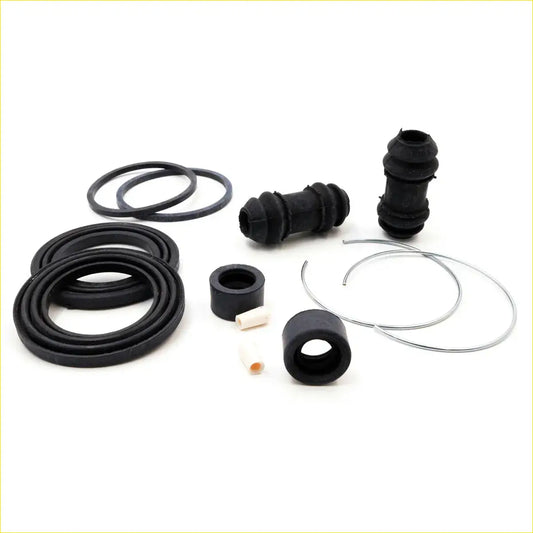 Black rubber and metal disc brake seal kit components for mazda b2000 b2200 b2600 bravo 1985-1998 shown here