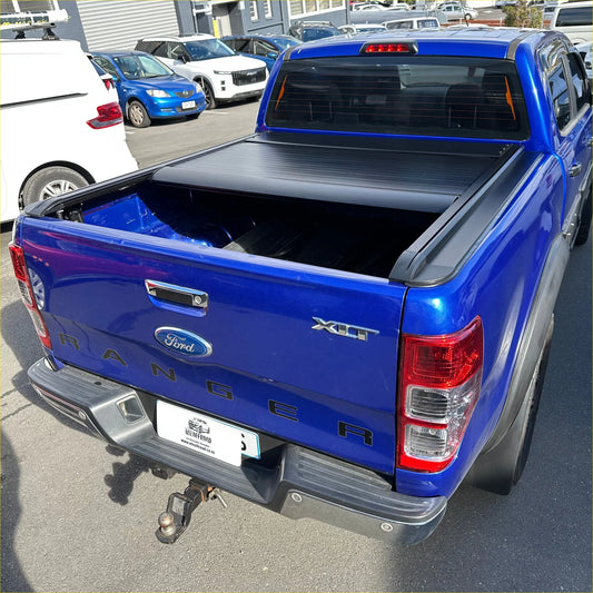 Back view of blue ford ranger xlt with black electric roller shutter tonneau cover for ford ranger px1 px2 px3