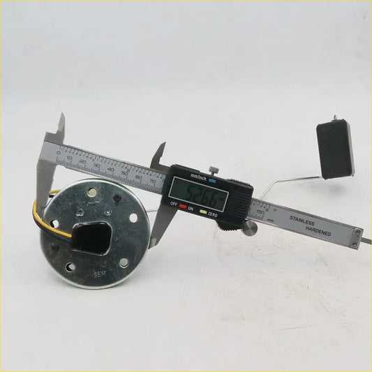 Black digital caliper measuring circular metal fuel tank gauge sending unit with wiring for toyota hilux 1979-1997