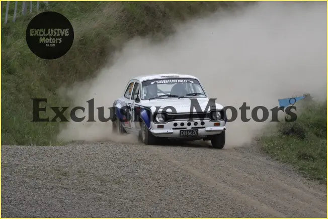 White glass rear windscreen for ford escort mk1 with a rally car speeding on a dusty gravel track in blue and black decals