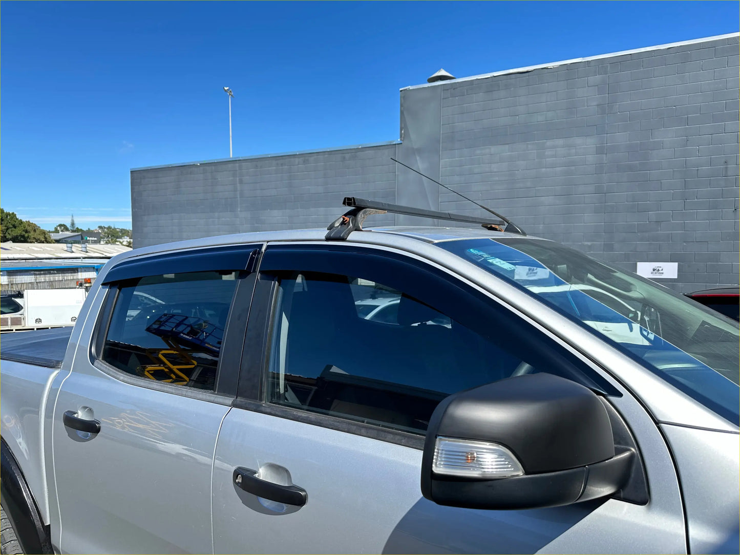 Silver ford ranger px1 2012-2015 with monsoon bonnet guard roof rack and black side mirrors aftermarket style