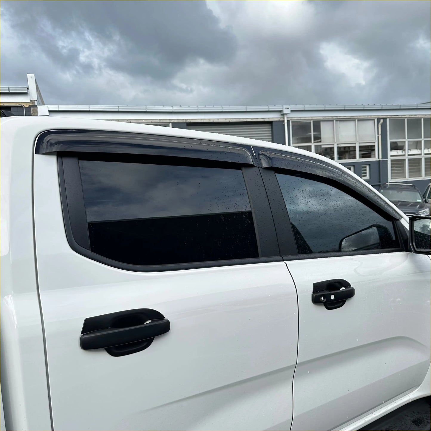 Black plastic window visors installed on white ford ranger 2022 plus with monsoon bonnet guard oem style