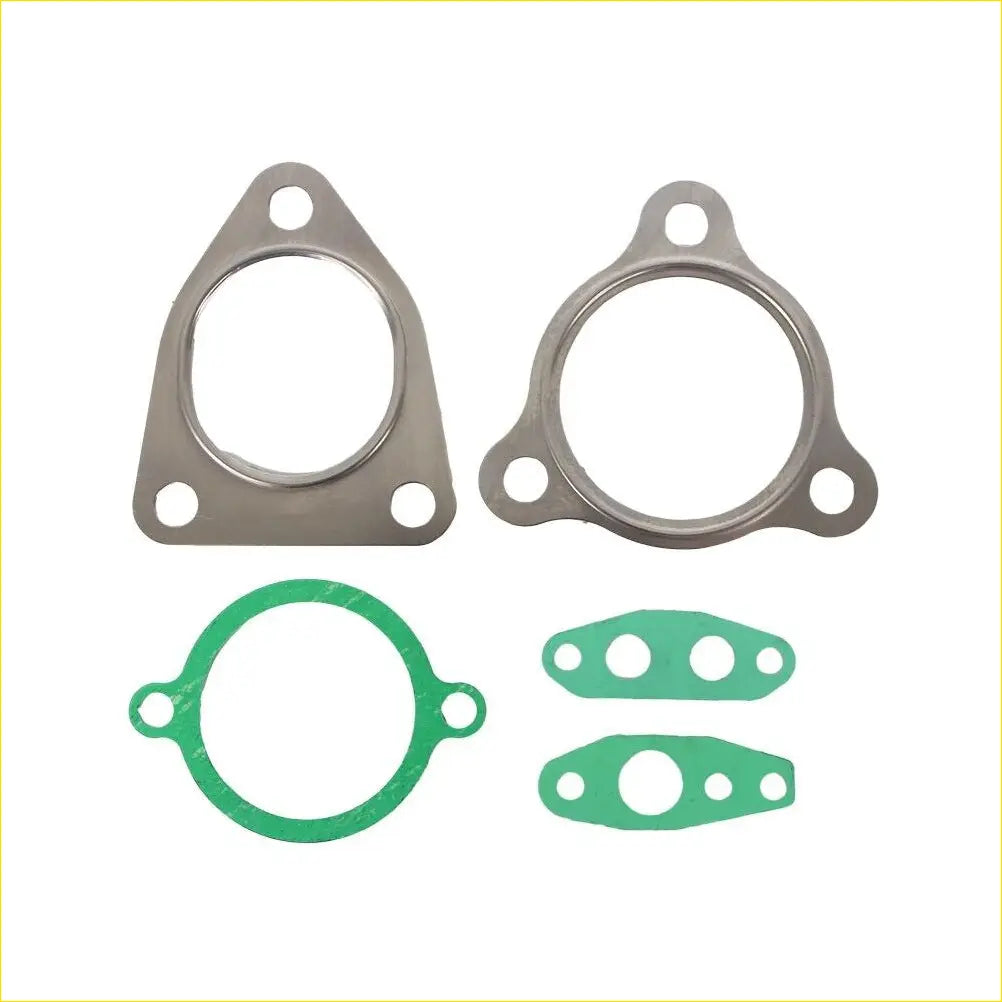 Set of four metallic and green turbo charger gaskets with varied shapes for toyota hilux landcruiser engines