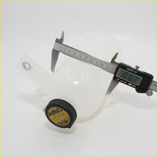 Transparent plastic radiator reserve tank with black cap and yellow warning labels for toyota hilux kun10 kun25 kun36
