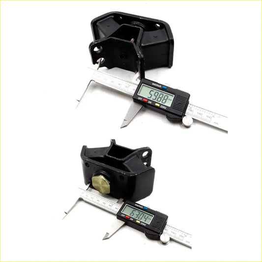 Rear engine mount for Toyota Hilux 1988-1997 showing black rubber suspension mount with brass hex bolt and metal brackets