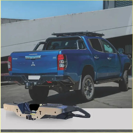 Blue mitsubishi triton pickup with black roof rack showing rockamor elite steel rear step towbar at the back