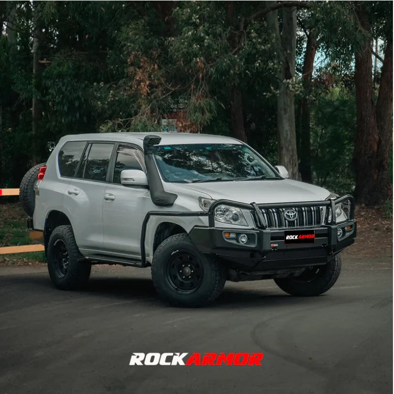 White SUV with black accessories featuring the Rockarmor Elite Steel Bullbar for Toyota Prado 150