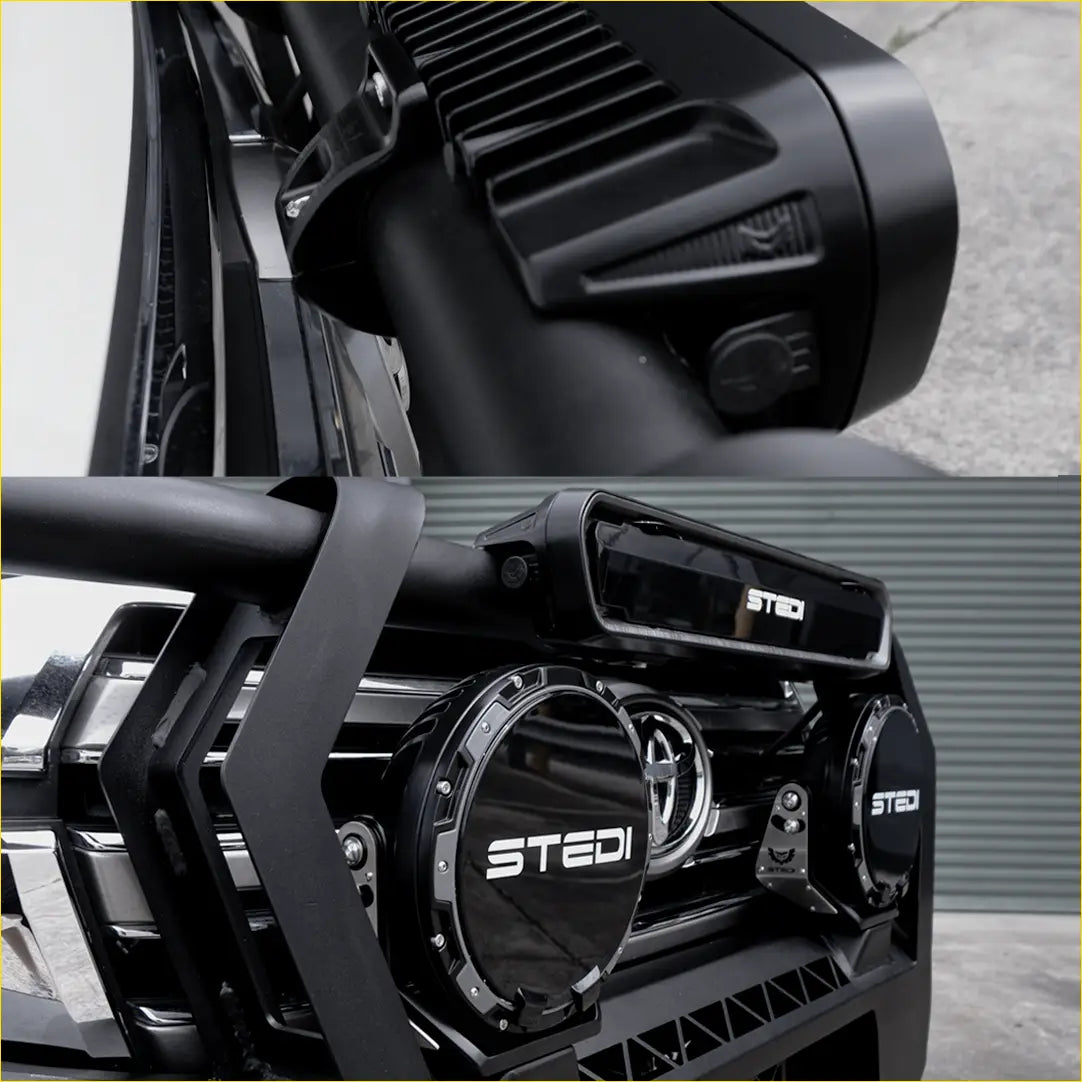 Black stedi off-road light bar with integrated circular spotlights and textured housing on rockarmor gt steel hoop bullbar
