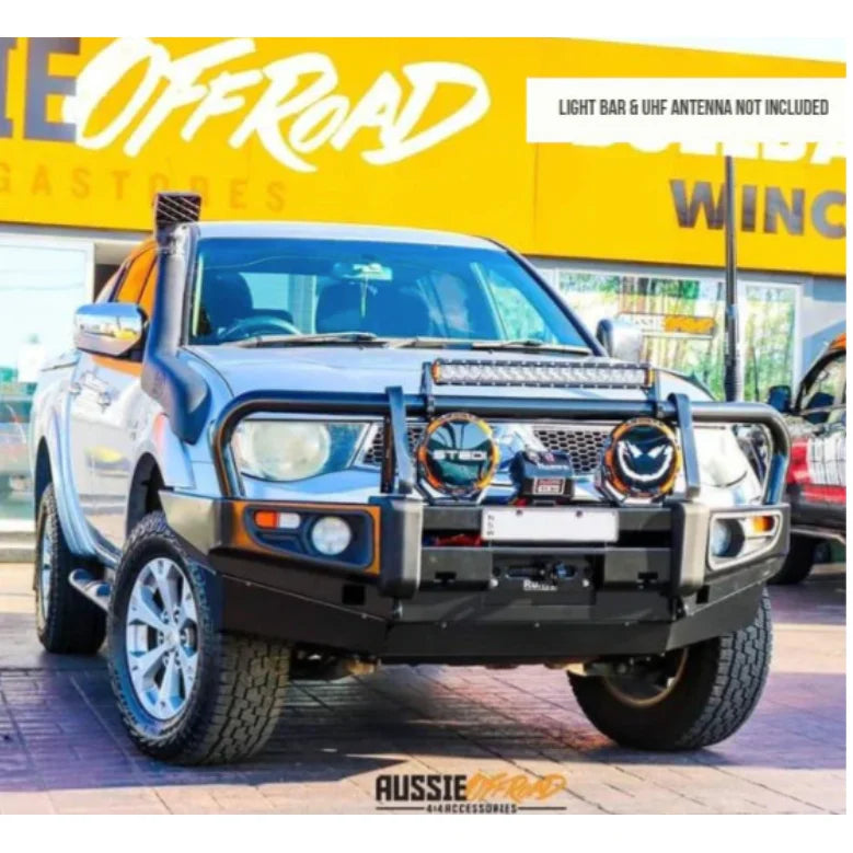 Silver off-road truck with bull bar, driving lights, and synthetic winch rope for Mitsubishi Triton Challanger 2009-2015