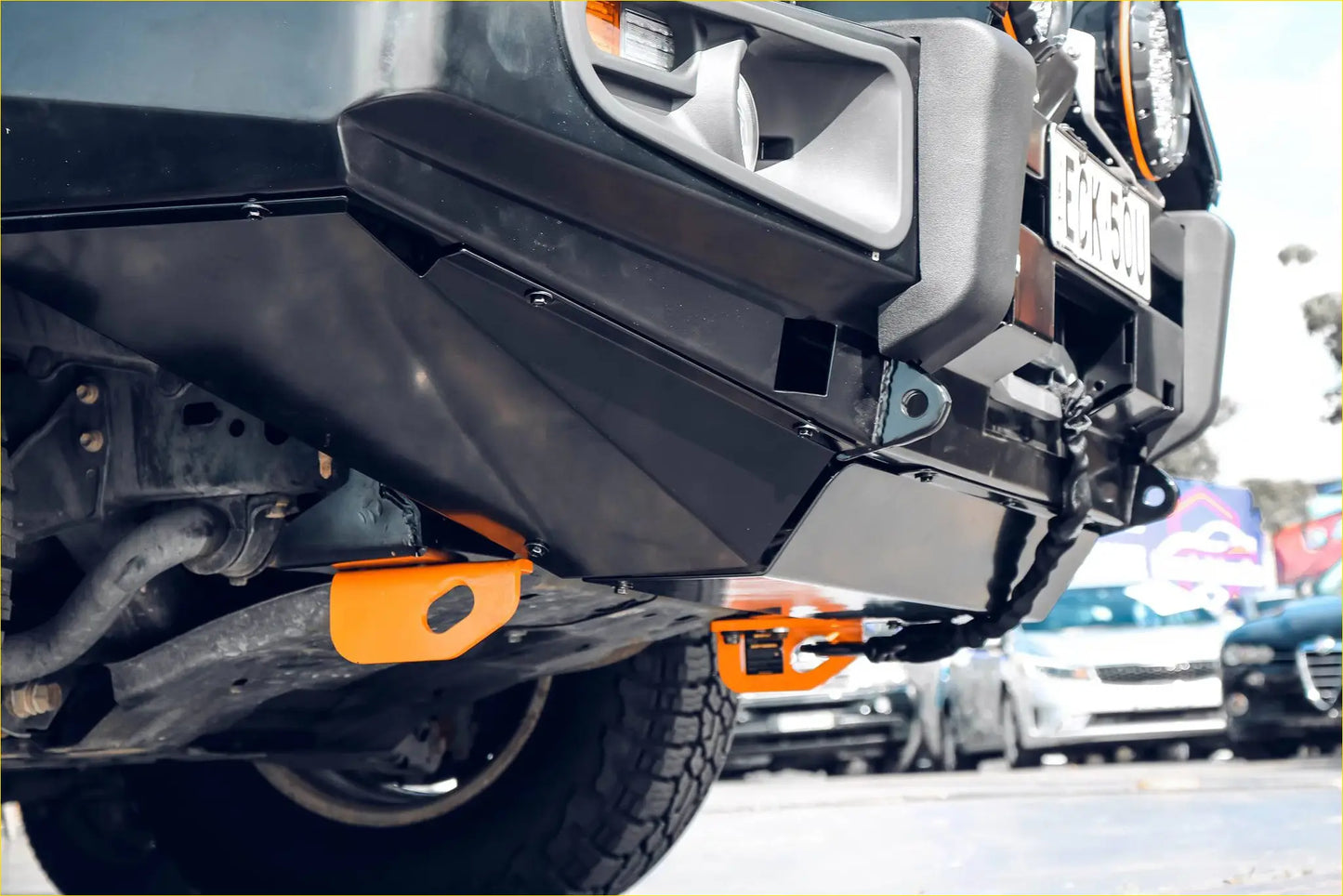 Black and orange rockarmor premium steel bullbar with integrated winch points for toyota landcruiser 200 gx gxl
