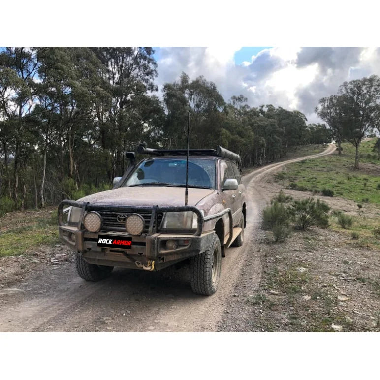 Mud-covered off-road vehicle with Rockarmor premium steel bullbar and fog lights