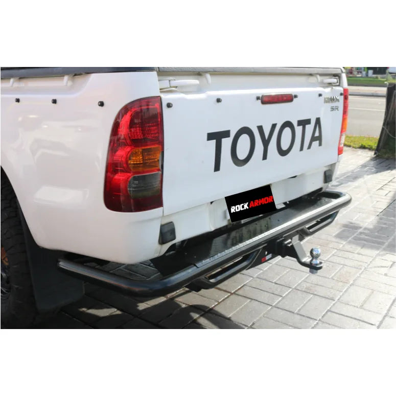 White Toyota pickup truck with Rockarmor premium steel rear step tow bar for Hilux N70