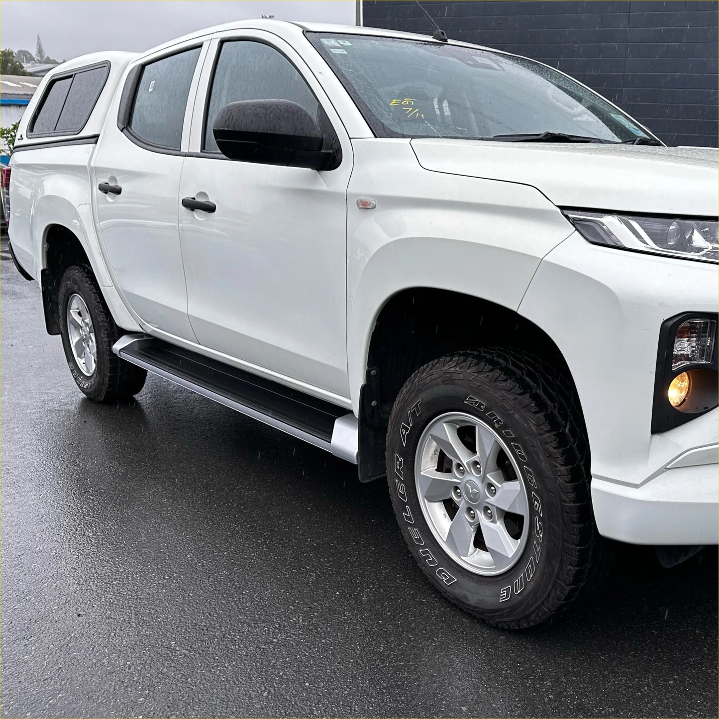 White mitsubishi triton double cab with black side step running boards and alloy wheels oem style 2019-2023