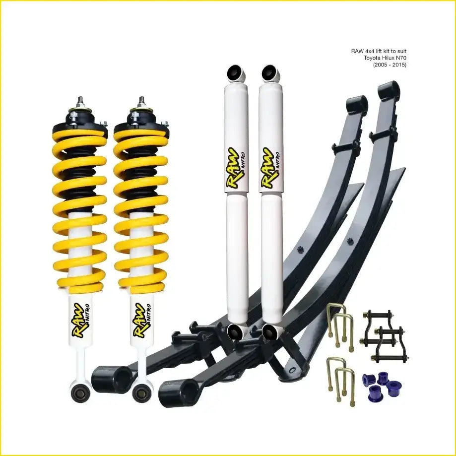 Yellow and white coil springs with black tops and white shock absorbers with yellow raw logo for toyota hilux surf 180 series