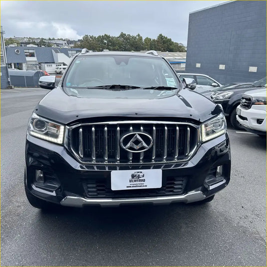 Black matte suv with chrome grille and sleek led headlights showing why every ute needs a bonnet protector nz in 2026