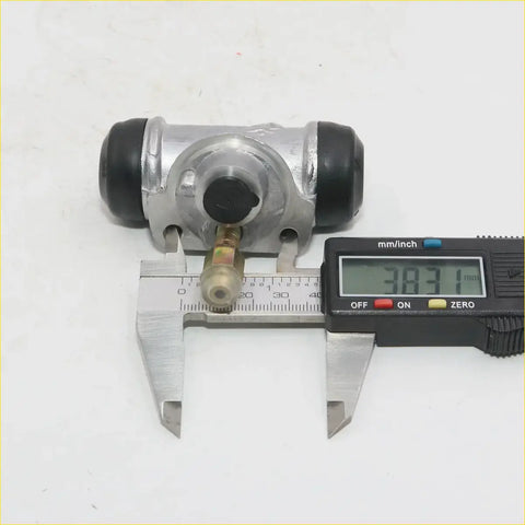 Silver metal 11/16 rear wheel brake cylinder for nissan datsun 720 d21 navara with black rubber caps and brass fitting measured at 38.71 mm