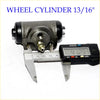 Black and metallic gray 13/16 rr wheel brake cylinder with brass fitting shown next to digital caliper for size on back side