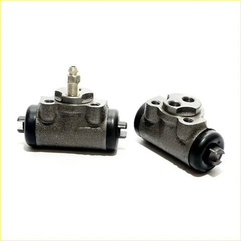 Gray metallic 15/16 rear brake cylinder with black rubber seals and threaded fittings for mitsubishi triton l200 back side
