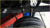 Black rubber tire with visible treads mounted on a 2 inch rear suspension block lift kit for nissan navara d40 chassis