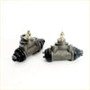 Pair of gray metallic 3/4 rear wheel brake cylinders with black rubber seals and brass fittings for Datsun Nissan 620