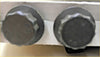 Two dark gray hexagonal headed bolts with textured surface for challenger l200 triton 25 td hole head gasket kit