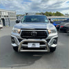 Silver toyota hilux with 304 stainless steel medium size nudge bar chrome bull bar and roof rack visible front side