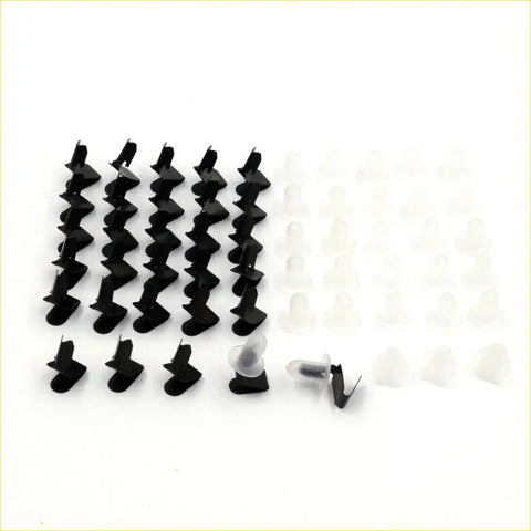 Black and translucent plastic door panel clips arranged in rows for mazda 600 800 110 cosmo r360 616 capella