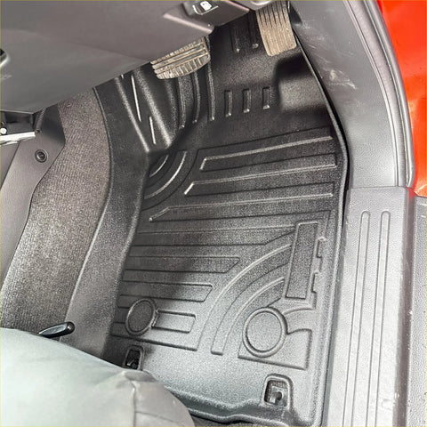 Black molded rubber 3d car mat with textured ridges and circular pedal cutouts for isuzu d-max 2021-2023