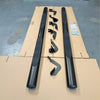 Black textured 4 inch oval tube running board side step rails with matching mounting brackets for hilux truck