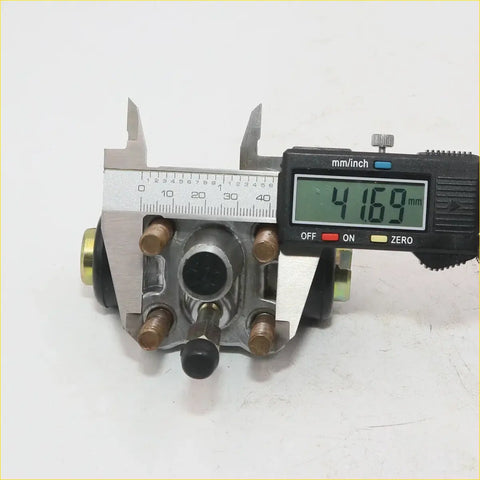 Silver metal 5/8 inch rear wheel brake master cylinder with brass fittings and black boot for Nissan 720 back side