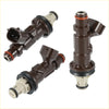 Brown plastic fuel injectors with black and beige rubber seals for toyota tacoma tundra 3.4l v6 shown from back side