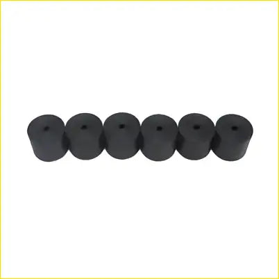 Black rubber tire valve caps shown from the back arranged in a row for 6x 2 inch hdpe body lift blocks ute kit