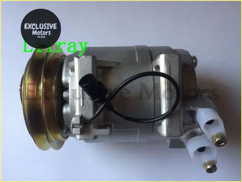 Silver metallic a/c compressor for mitsubishi pickup triton l200 with brass pulley and black wiring seen from back side