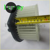 White plastic a/c heater blower motor with black mounting bracket for Isuzu d-max 2012 and Amigo 1998-1999 showing back side