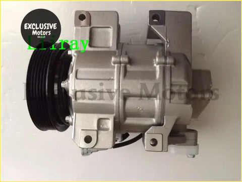 Silver automotive ac compressor for nissan x-trail with black pulley on one end shown from the back side