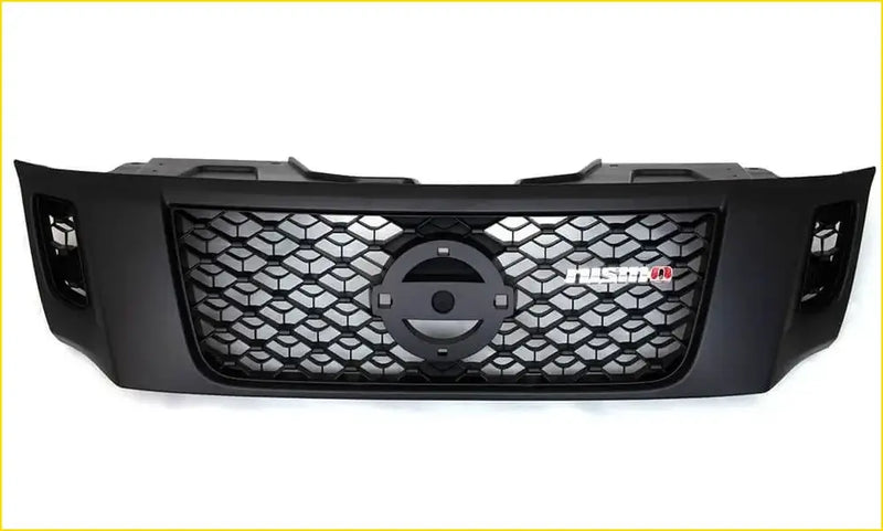 Black aftermarket grill for nissan navara nismo with honeycomb mesh pattern and fusion badge on the front side