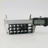 Black plastic rectangular air vent grid being measured with a digital caliper for nissan datsun d21 1986-1997