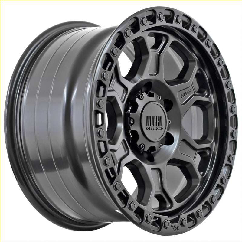 Dark gray matte-finished alpha enduro offroad wheel with rugged multi-spoke design and bolted lug nuts