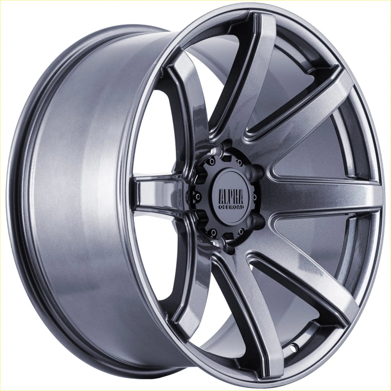A sleek dark gray metallic alloy wheel alpha gauntlet 2 hyper grey multi-spoke design with alpha off-road center cap