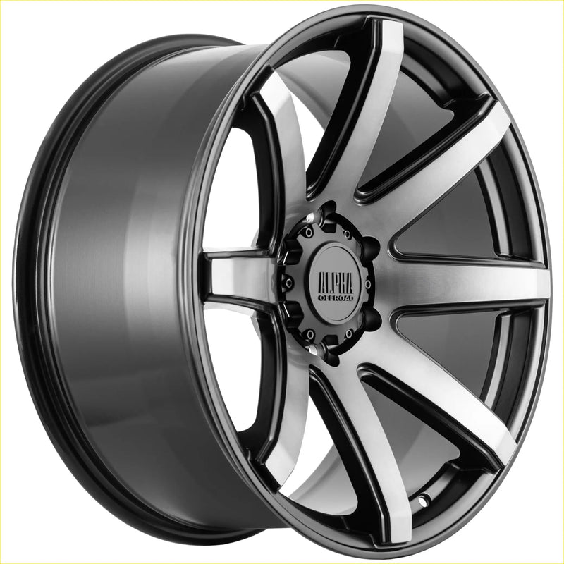 Black and silver two-tone ALPHA Nomad alloy wheel with multi-spoke design and alpha otomo logo in matt black dark grey tint