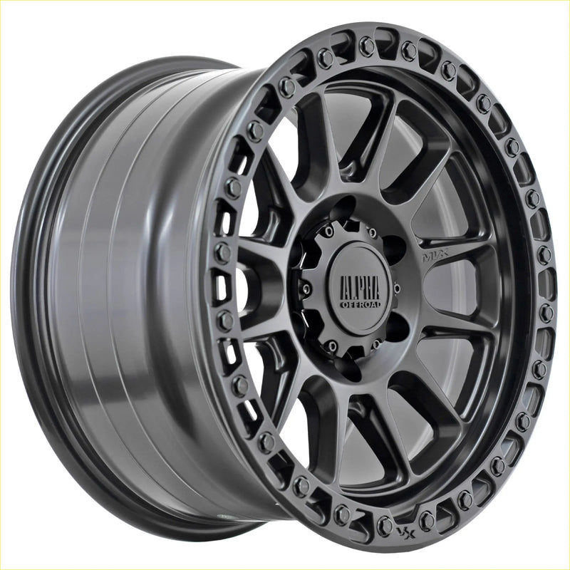 Dark gray matte finished alloy wheel with rugged multi spoke design and alpha off road logo alpha podium matt black
