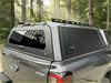 Black aluminium canopy hard-shell truck bed cover with tinted rear glass and roof rack for ford ranger 2022 back view