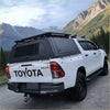 Rear view of white toyota hilux with black aluminium canopy and rear view glass 2015-2025 model