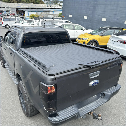 Black diamond plate aluminium hard lid tonneau cover with interford branding for ford ranger px double cab back side