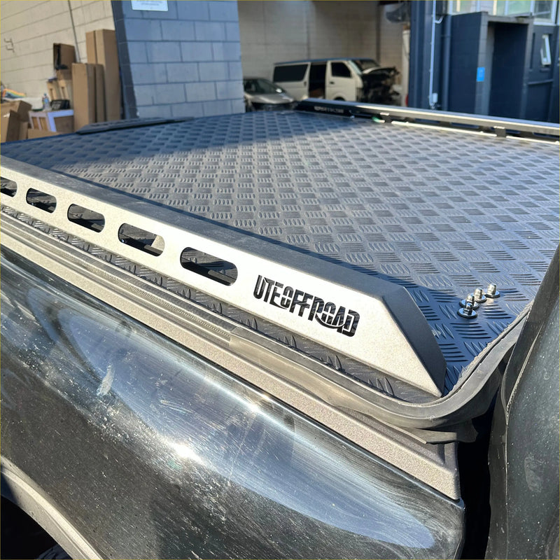 Silver aluminium heavy-duty hard lid with diamond-patterned metal and black trim for toyota hilux 2015-2021+