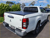 Back view of white mitsubishi triton glx-r with black aluminium tri fold hardlid tonneau cover 2015+