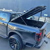 Black aluminum heavy-duty hard lid with reinforced design and support struts for byd shark 2025+ back view
