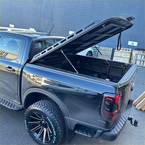 Black aluminum heavy-duty hard lid with reinforced design and support struts for byd shark 2025+ back view
